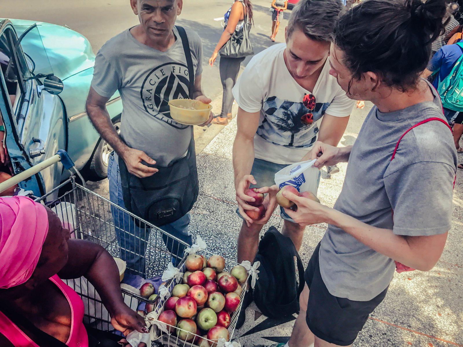 People buying apples in Cuba