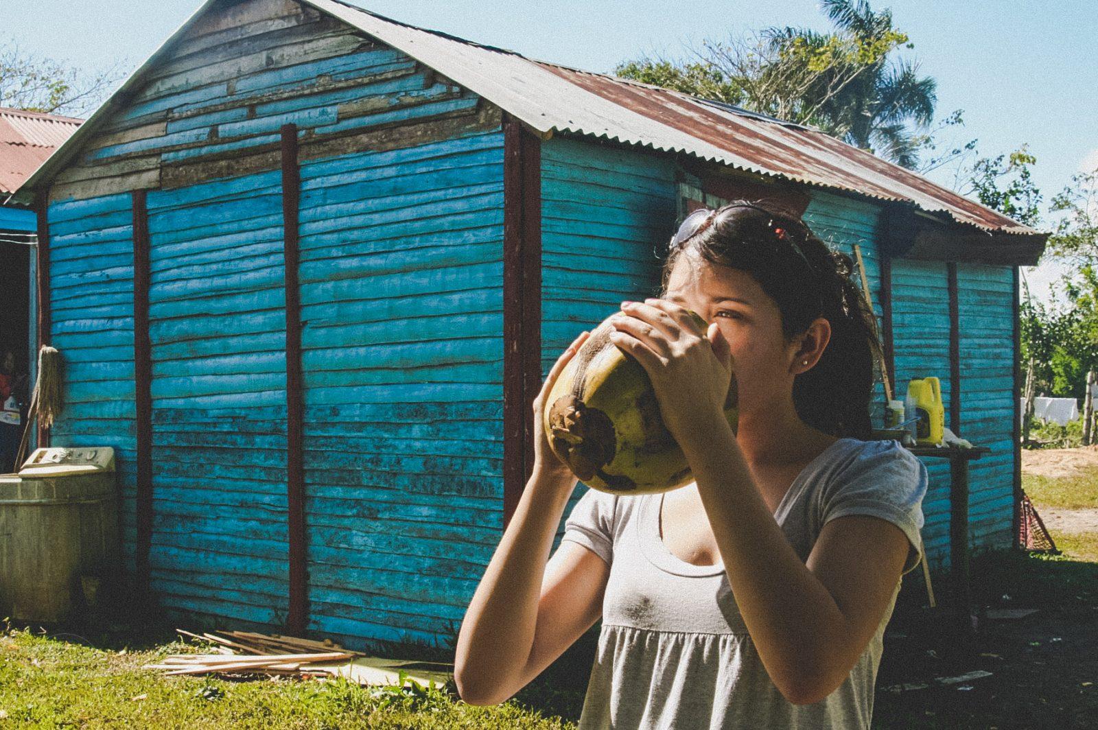A woman drinking coconut water.