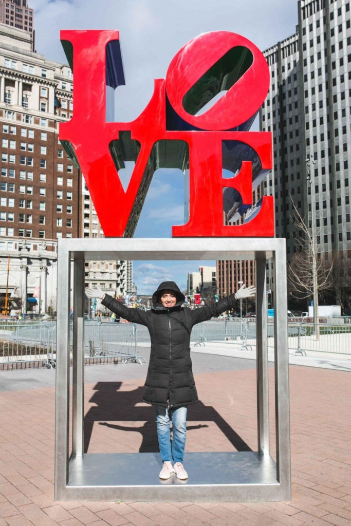 philadelphia love sign with a girl under it
