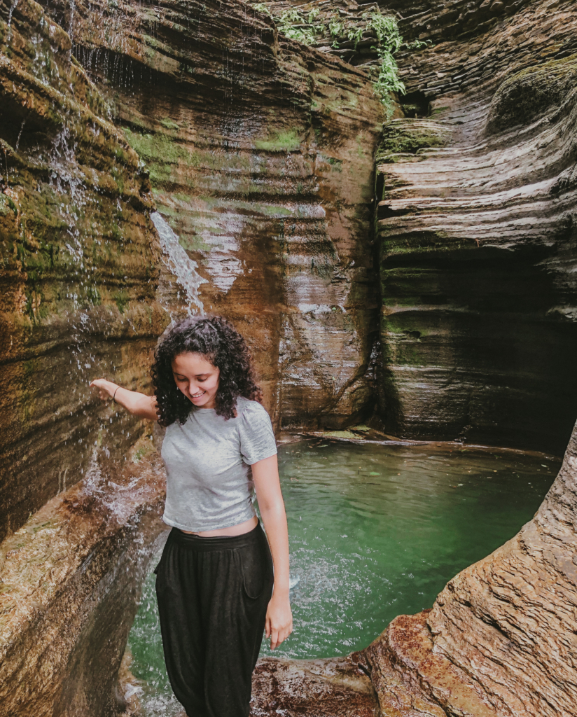 a beautiful water hole in upstate new york between rocks