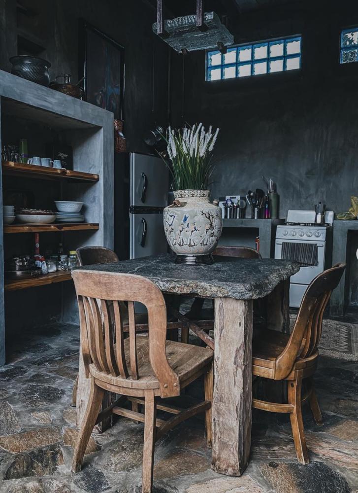 Wooden table and chairs in a kitchen in a boutique hotel.