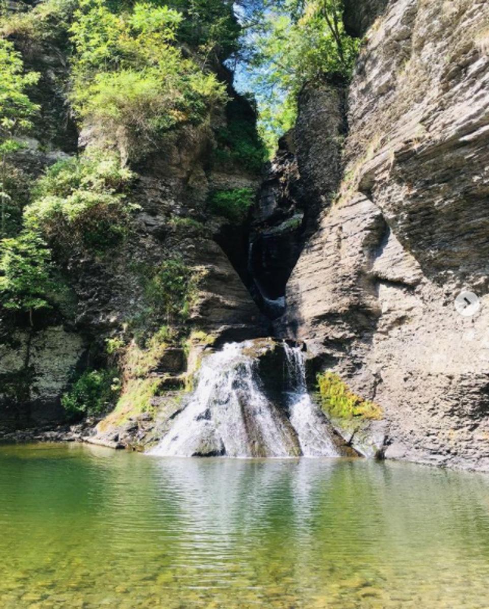 Mine Kill Falls surrounded walls of rock and a natural swimming pool.