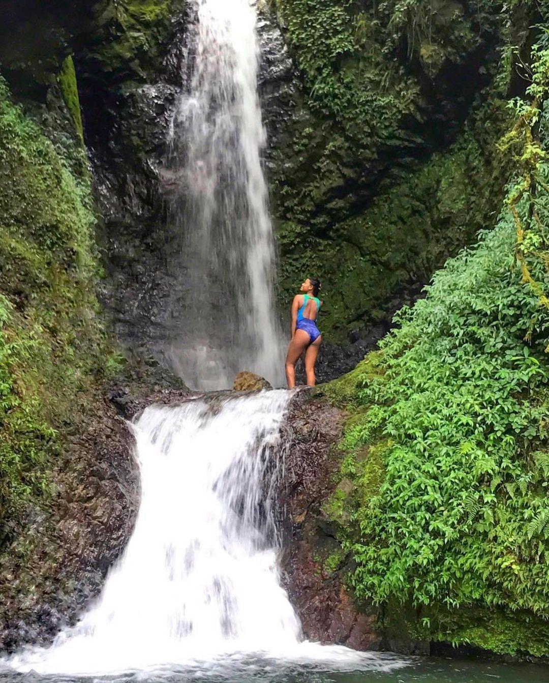 A woman admiring the Toro Flaco Waterfall.