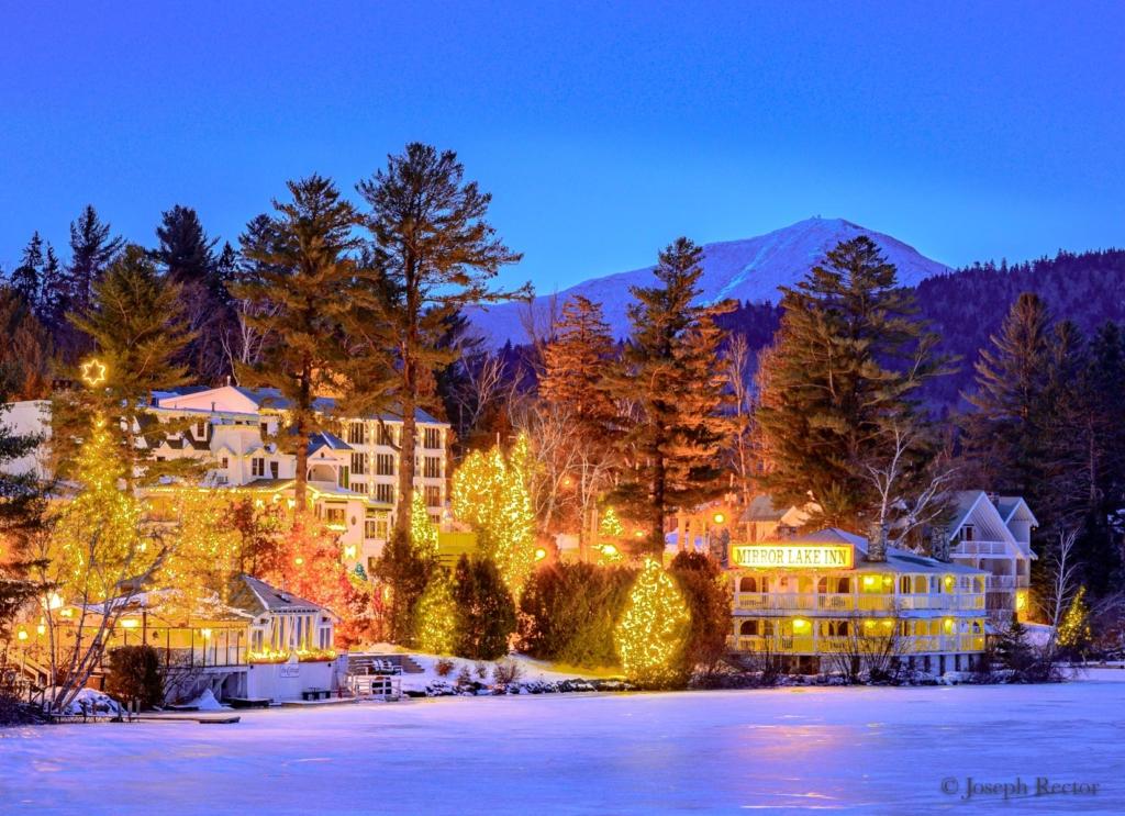 the small town of lake placid view of the lake and mountains and inn
