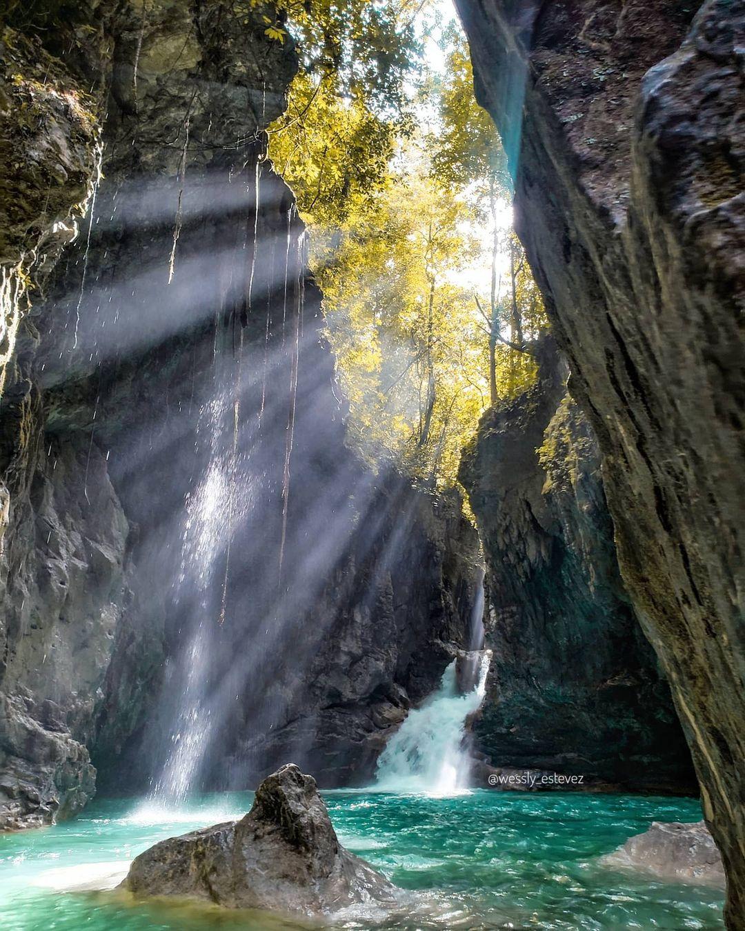 Sunlight shining over Las Golondrinas Waterfall.