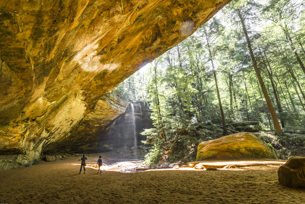 A recess cave in a forest.