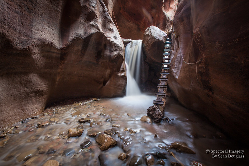 A waterfall inside a slot canyon.