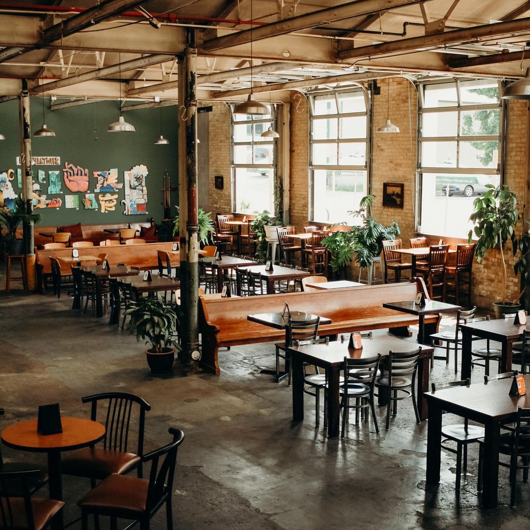 Interior of the brewery with lot of colors and plants.