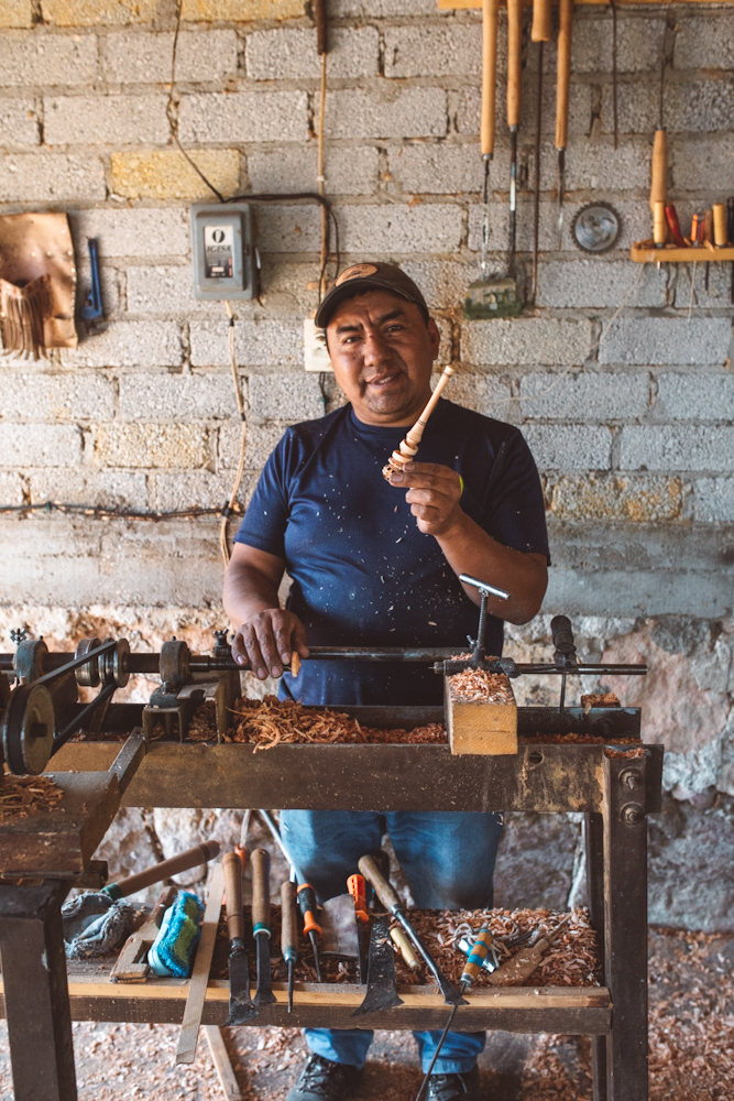 A man doing some wood works on Sierra Norte Mountains.