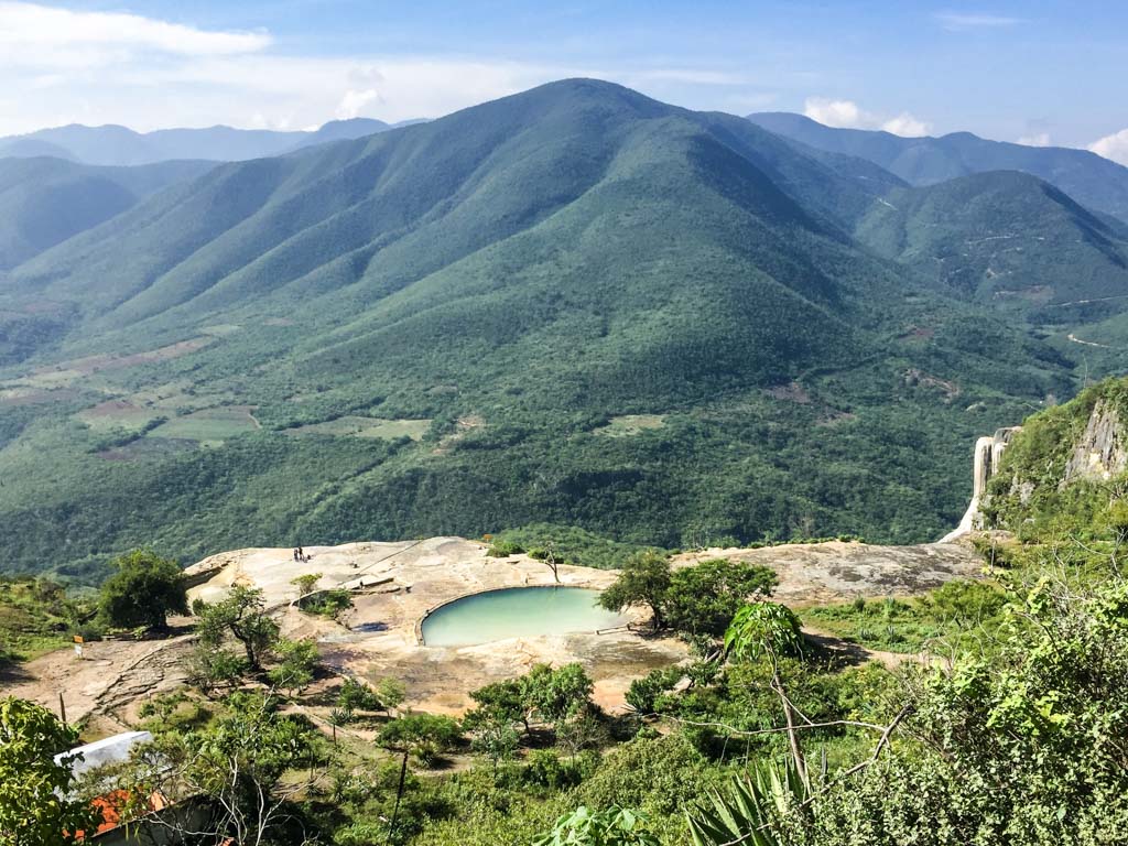 Hierve el Agua natural pool with the mountains in the background.