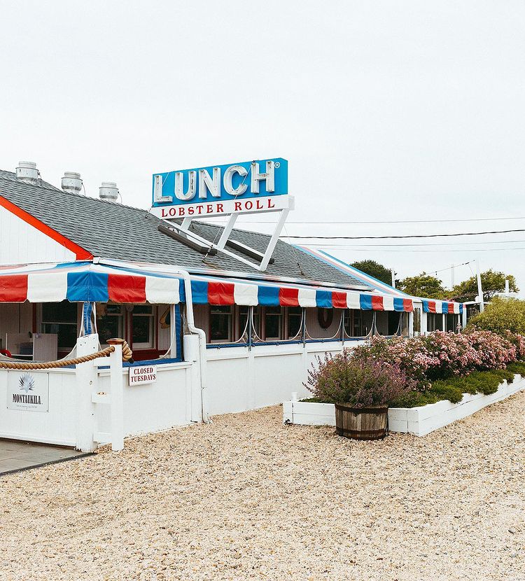 Exterior of the restaurant with beach vibe and a huge label written with a name of the restaurant. 