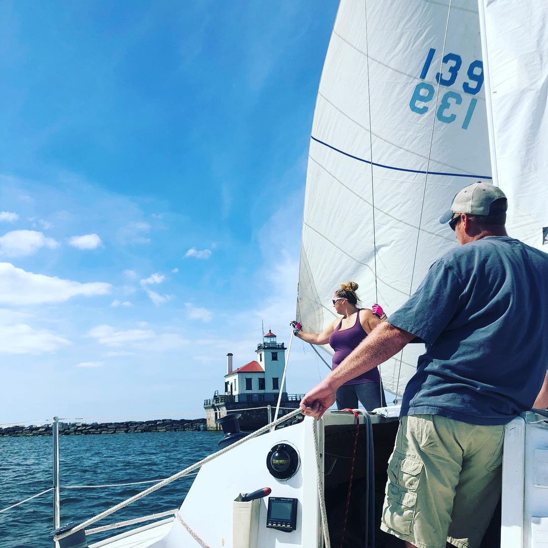 Man and Woman on the boat sailing.