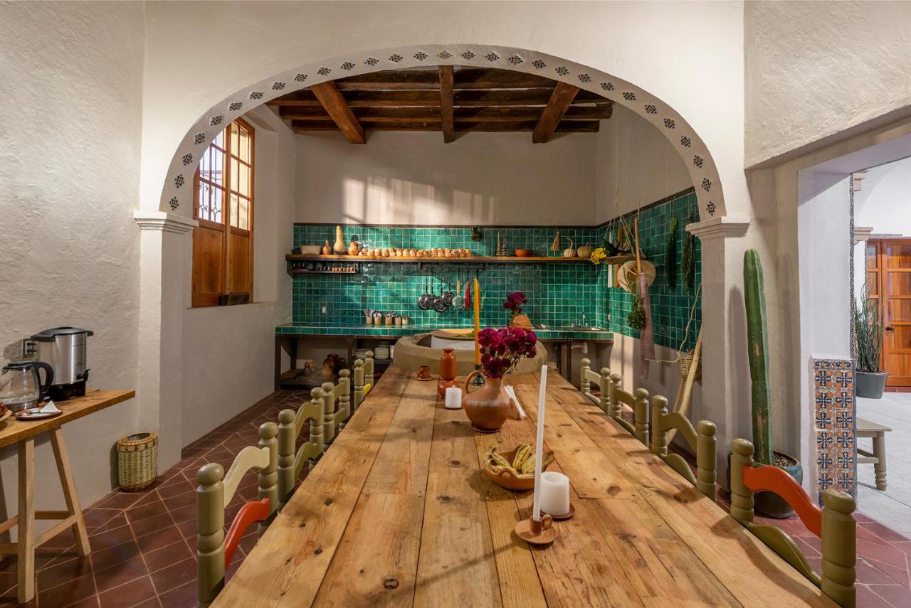 A long table with chairs at a kitchen in Oaxaca, Mexico.