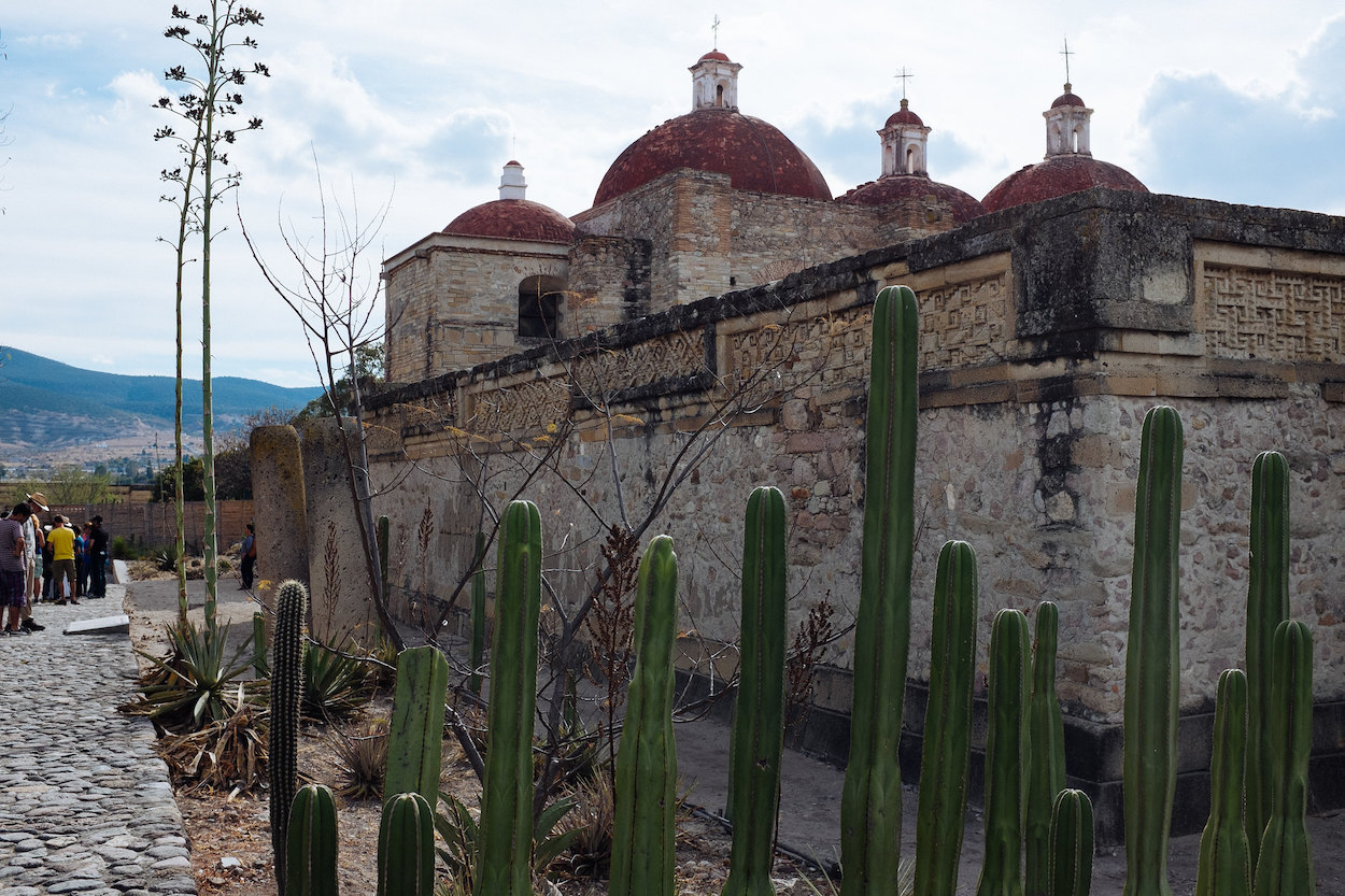 A church building with cacti outside in Mitla.
