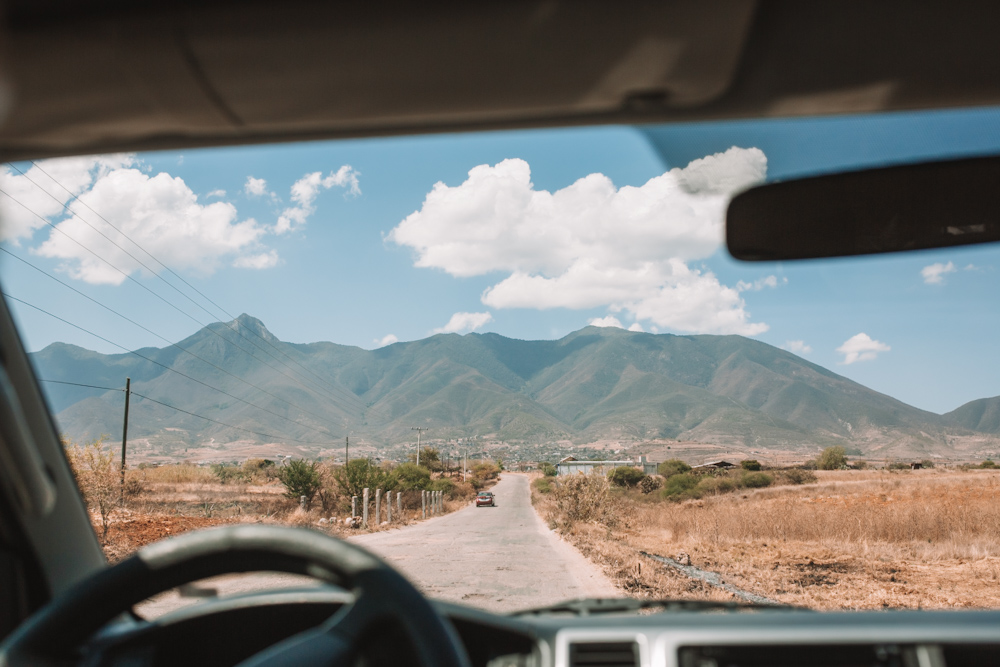 The road to San Marcos Tlapazola with mountains in the background.