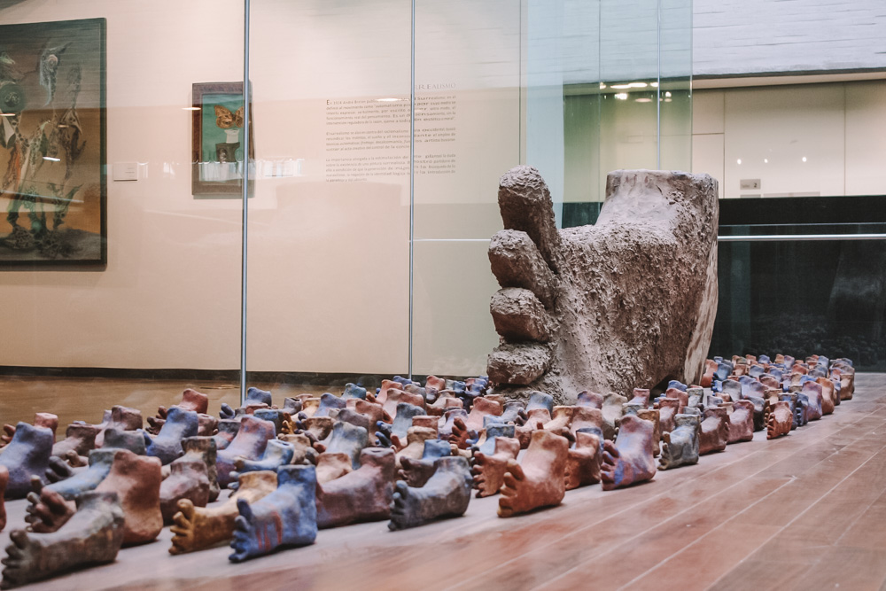 Feet-shaped stone art works at Memory and Tolerance Museum.