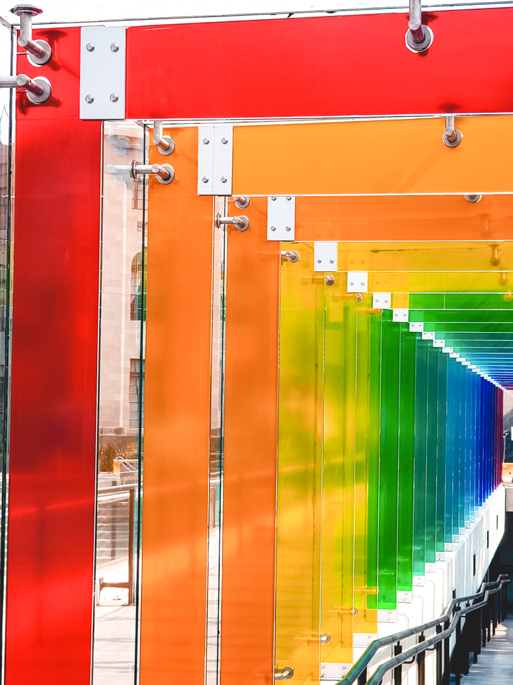 Stairs at Modern Art Museum with rainbow-color arches.