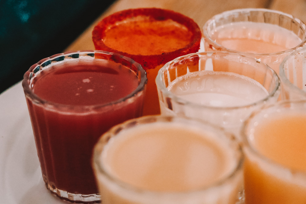 Glasses of drinks at The Pulque Museum.