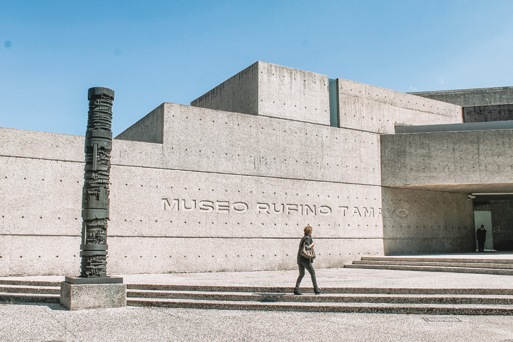 A woman walking outside the Rufino Tamayo Museum in Mexico City.