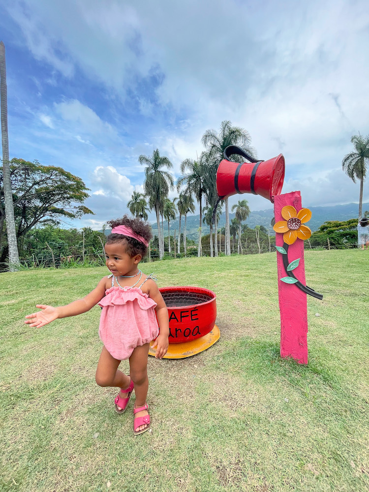 A child walking on trimmed grass.