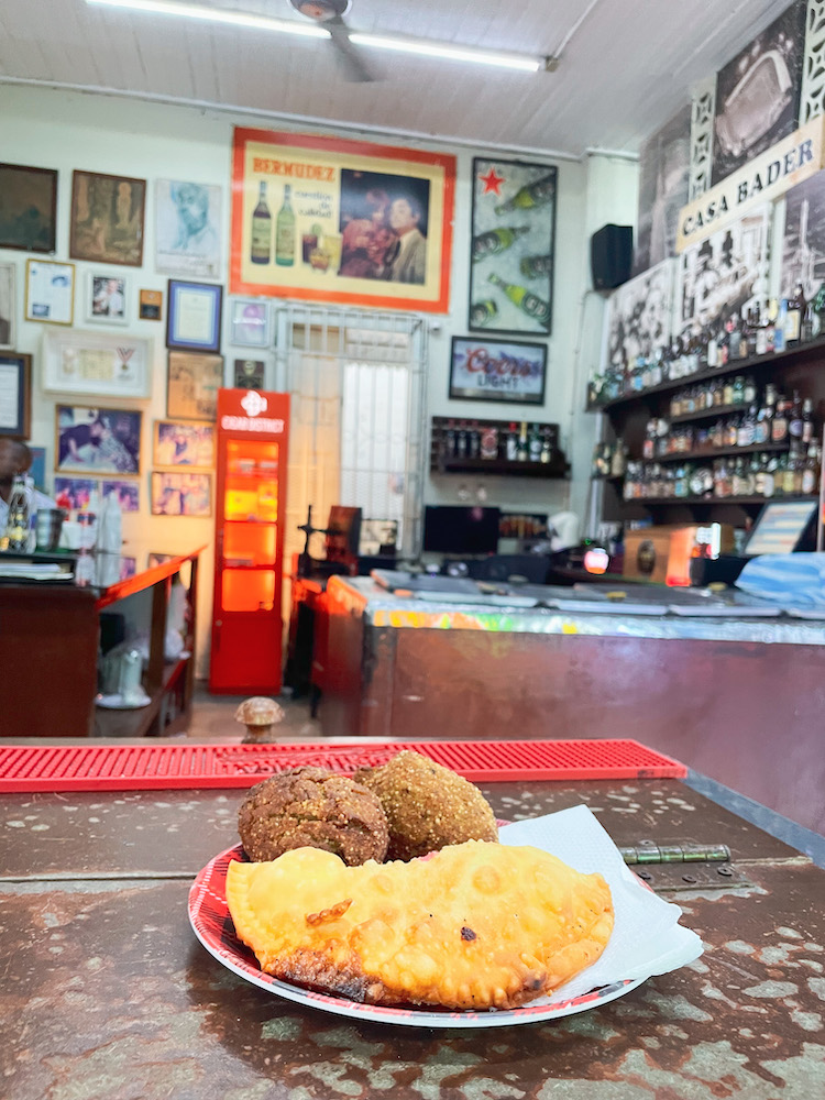 Quipes on a plate on a table at a bar in Santiago, Dominican Republic.