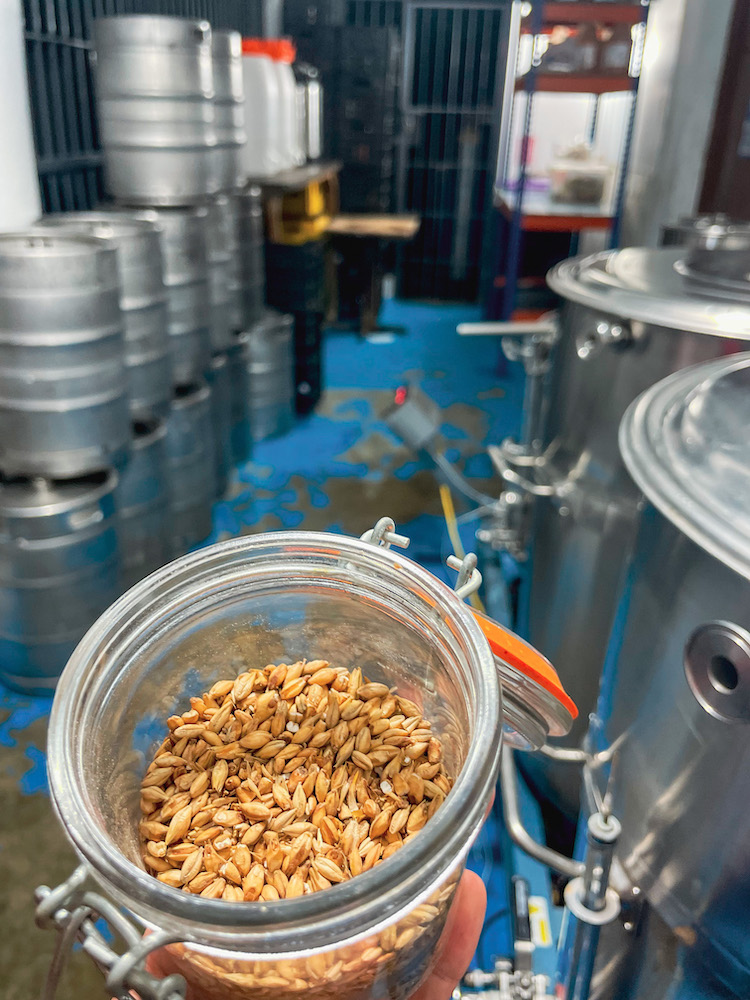 An open jar of grains at a brewery.