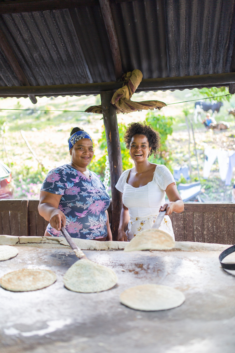 Two women making casabe.