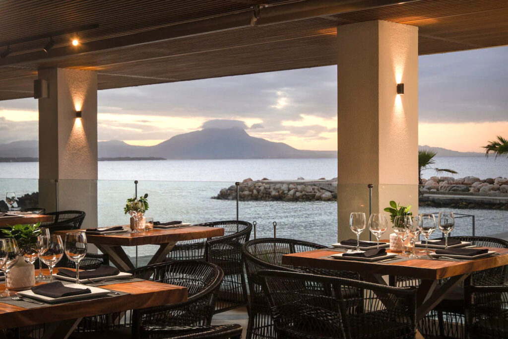 A restaurant at one of the best hotels in the Dominican Republic with the view of the sea and mountains.