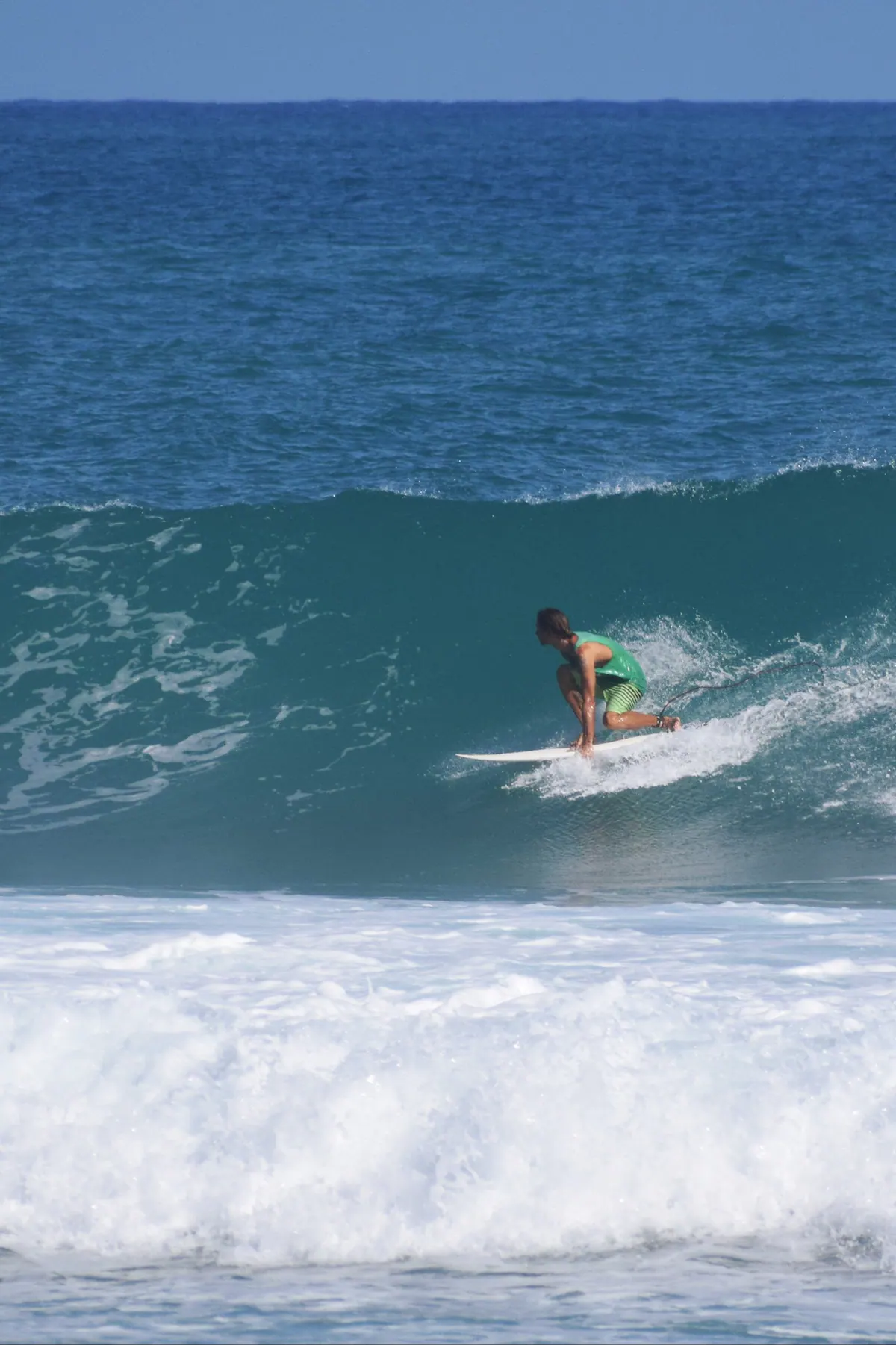 A person surfing in Puerto Plata sea.