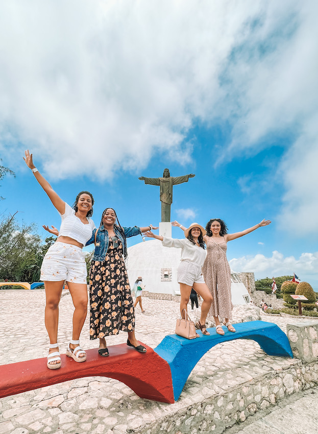 Four women imitating a statue in Puerto Plata.