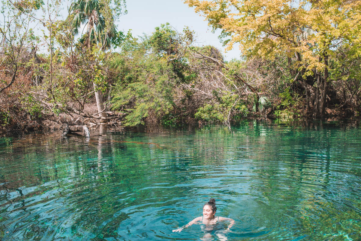 A woman swimming in Indigenous Eyes Ecological Reserve, one of the best places to visit in the Dominican Republic.