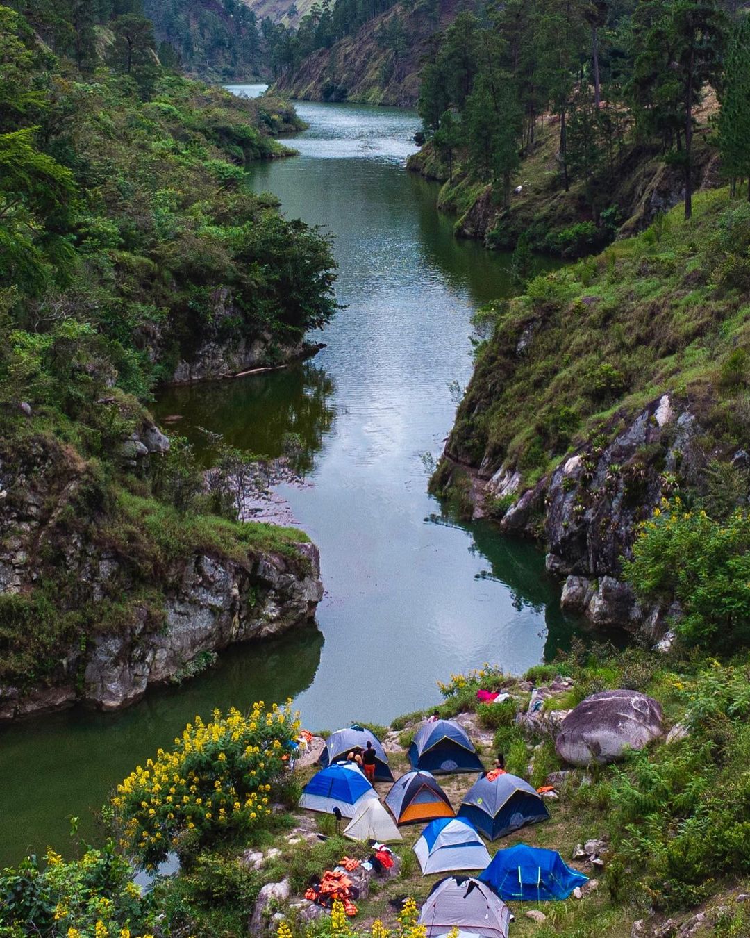 Camping tents by the river at Cañón de Río Blanco.