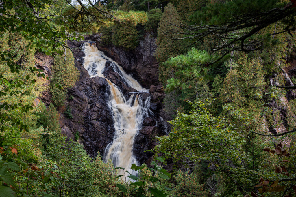 Big Manitou Falls in Wisconsin water cascading on rock surrounded by trees