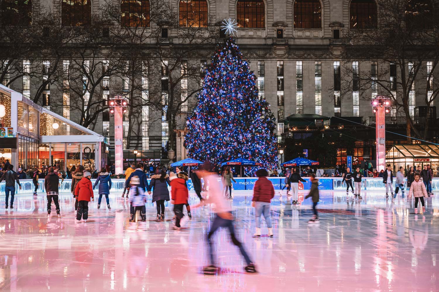 People ice skating things to do in NYC in December at Bryant Park
