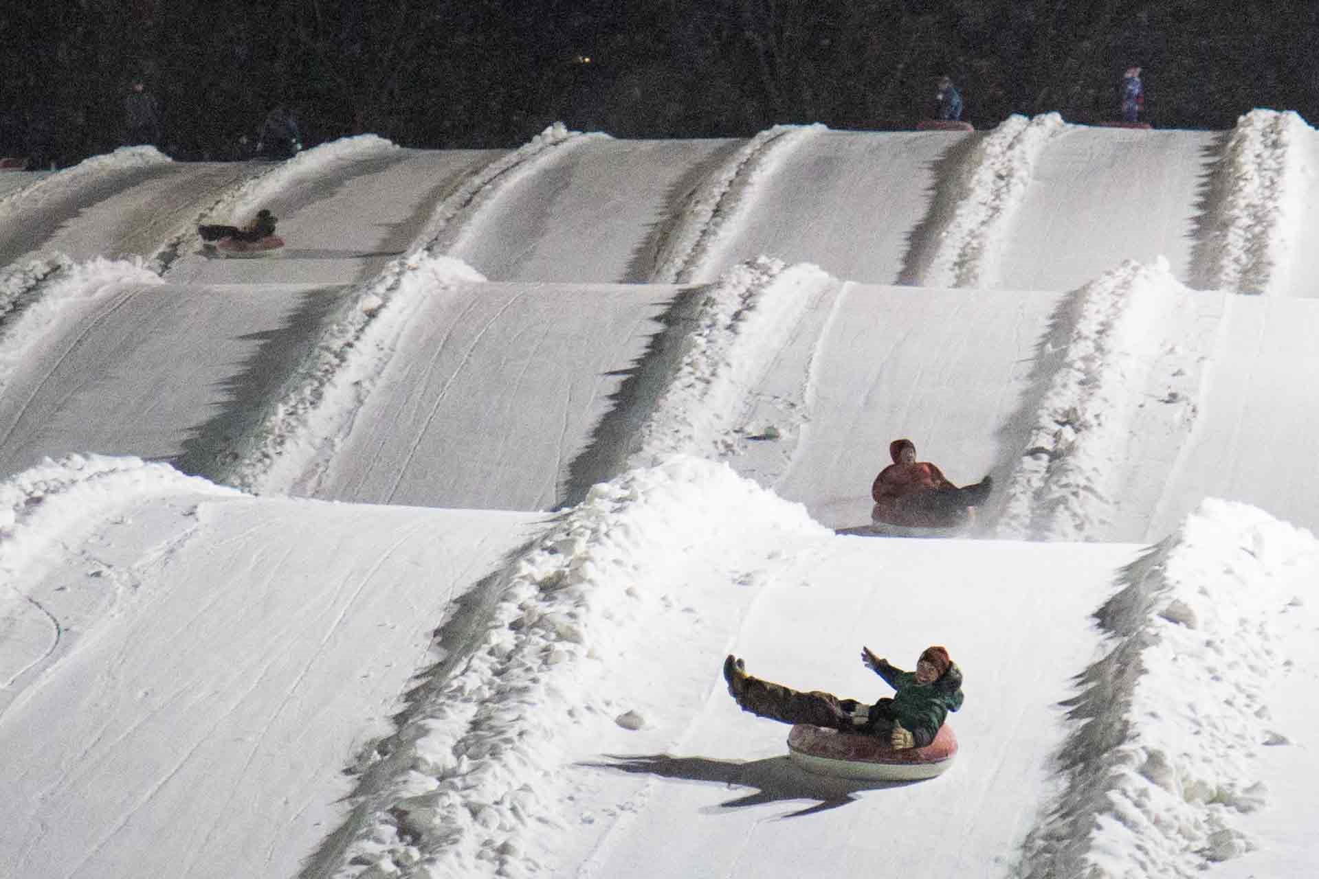 Sliding down the snowtubing slope at Mountain Creek