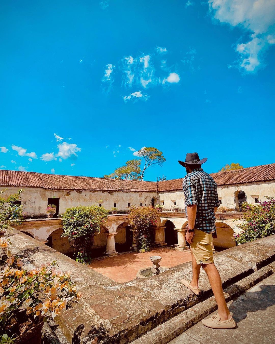 A man walking at Convento Capuchinas in Antigua, Guatemala