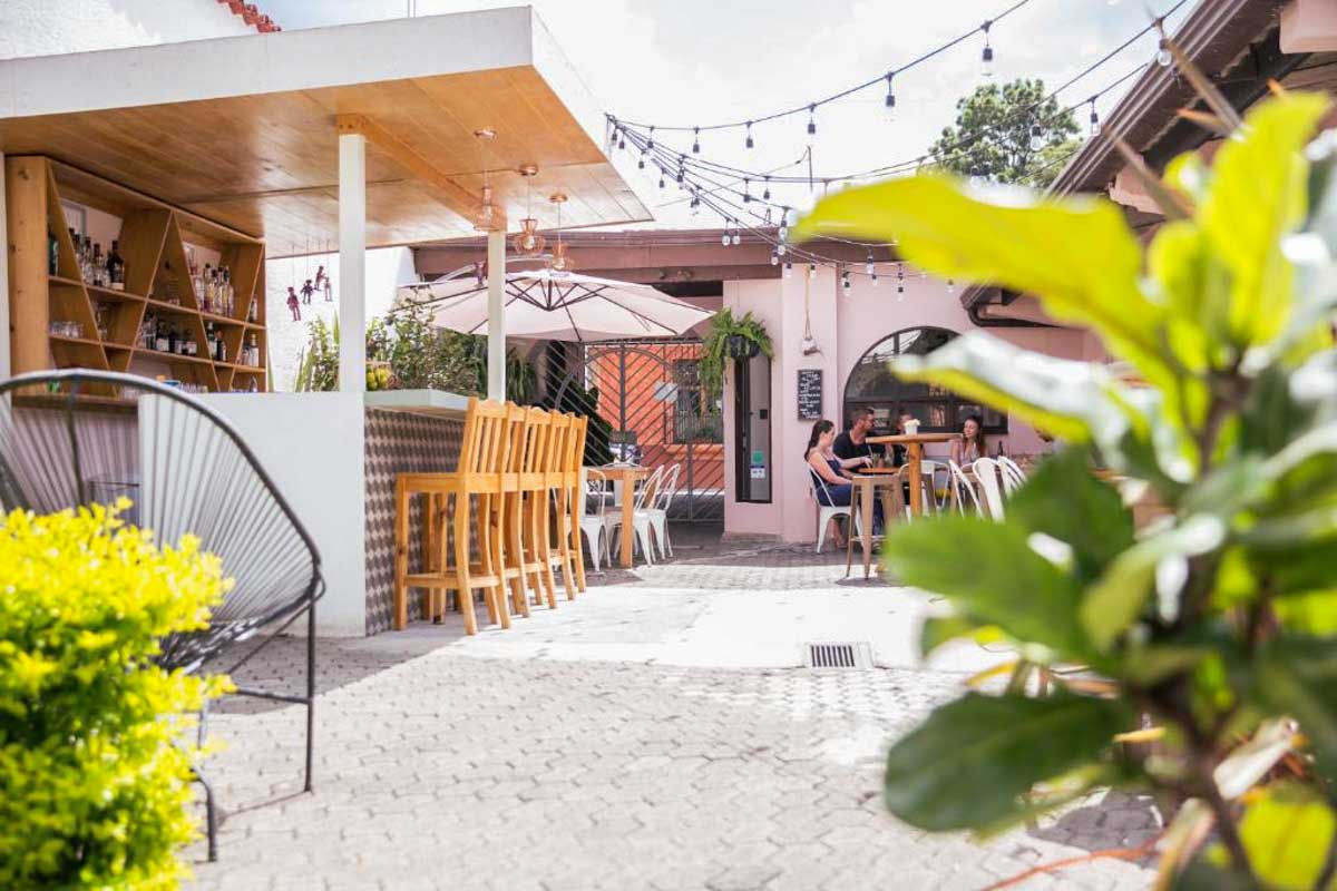 The outdoor bar and dining area of a hotel in Antigua, Guatemala