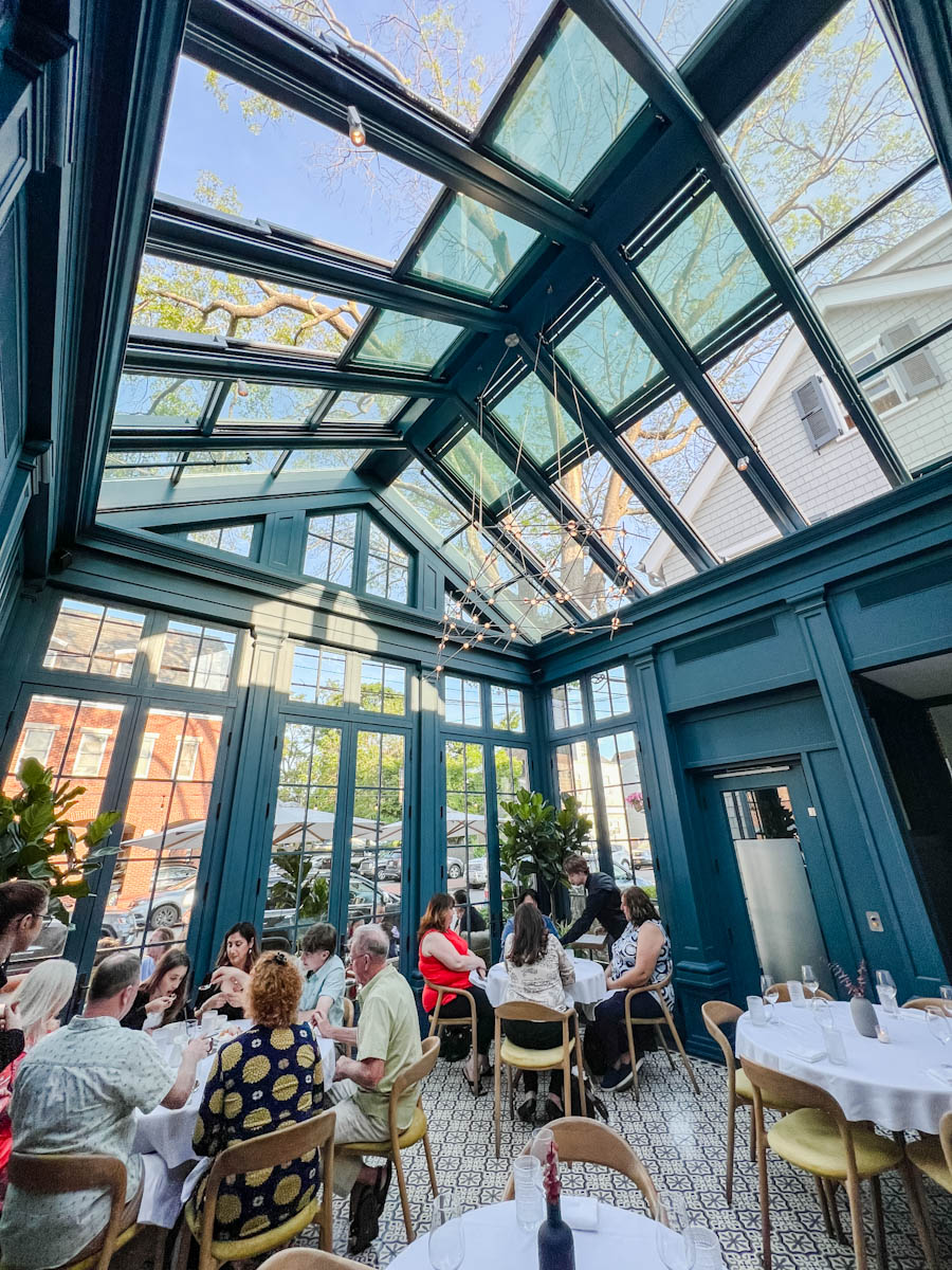 The inside of 2 Spring restaurant with people dining in at tables