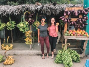 Two women at a fruit stand in the Dominican Republic