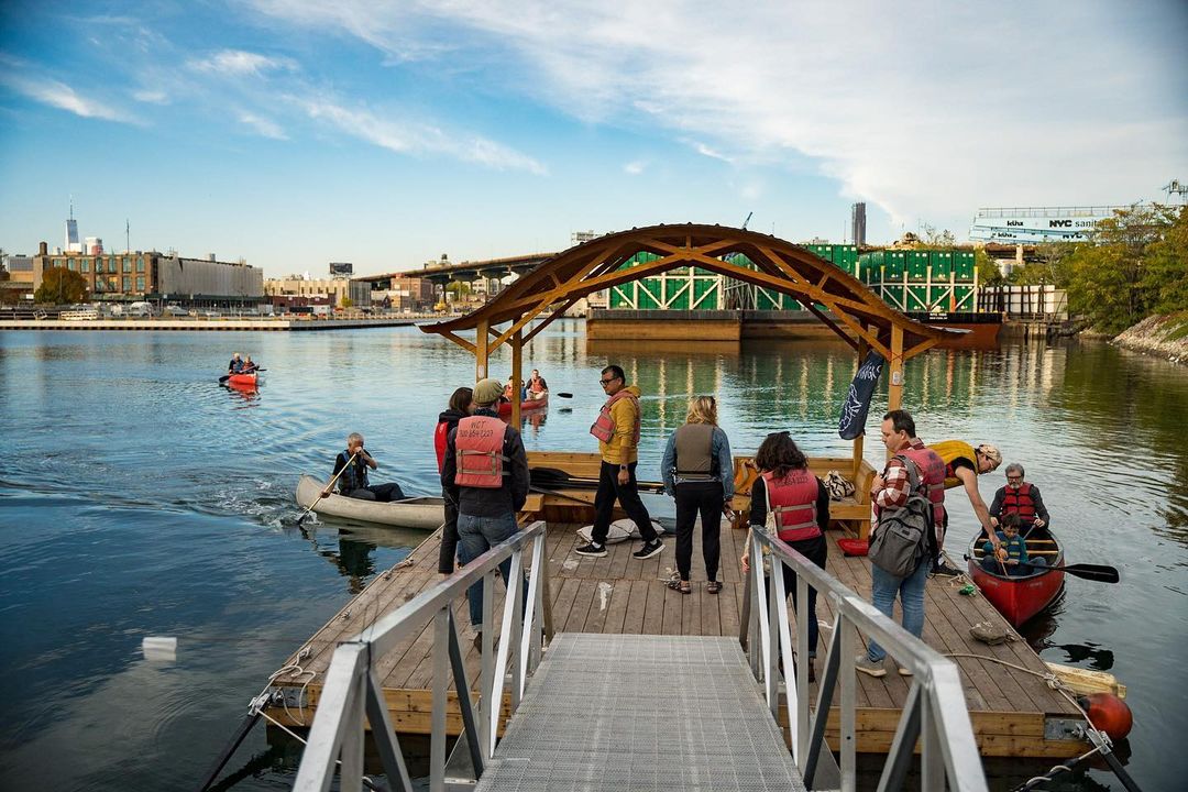 A group of people preparing to canoe in New York City in fall