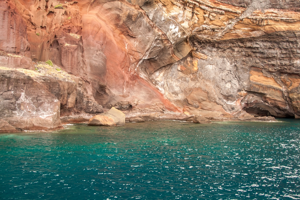 The rocky cliffs of Desertas Islands and blue-green waters