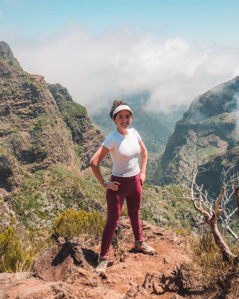 A woman standing on a mountain during a hike in Madeira, Portugal