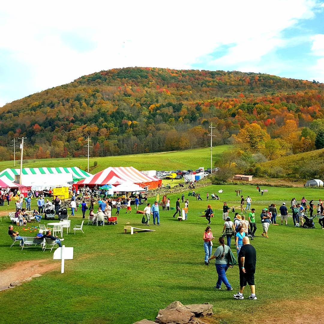 People at a festival at an outdoor area in Upstate New York in fall