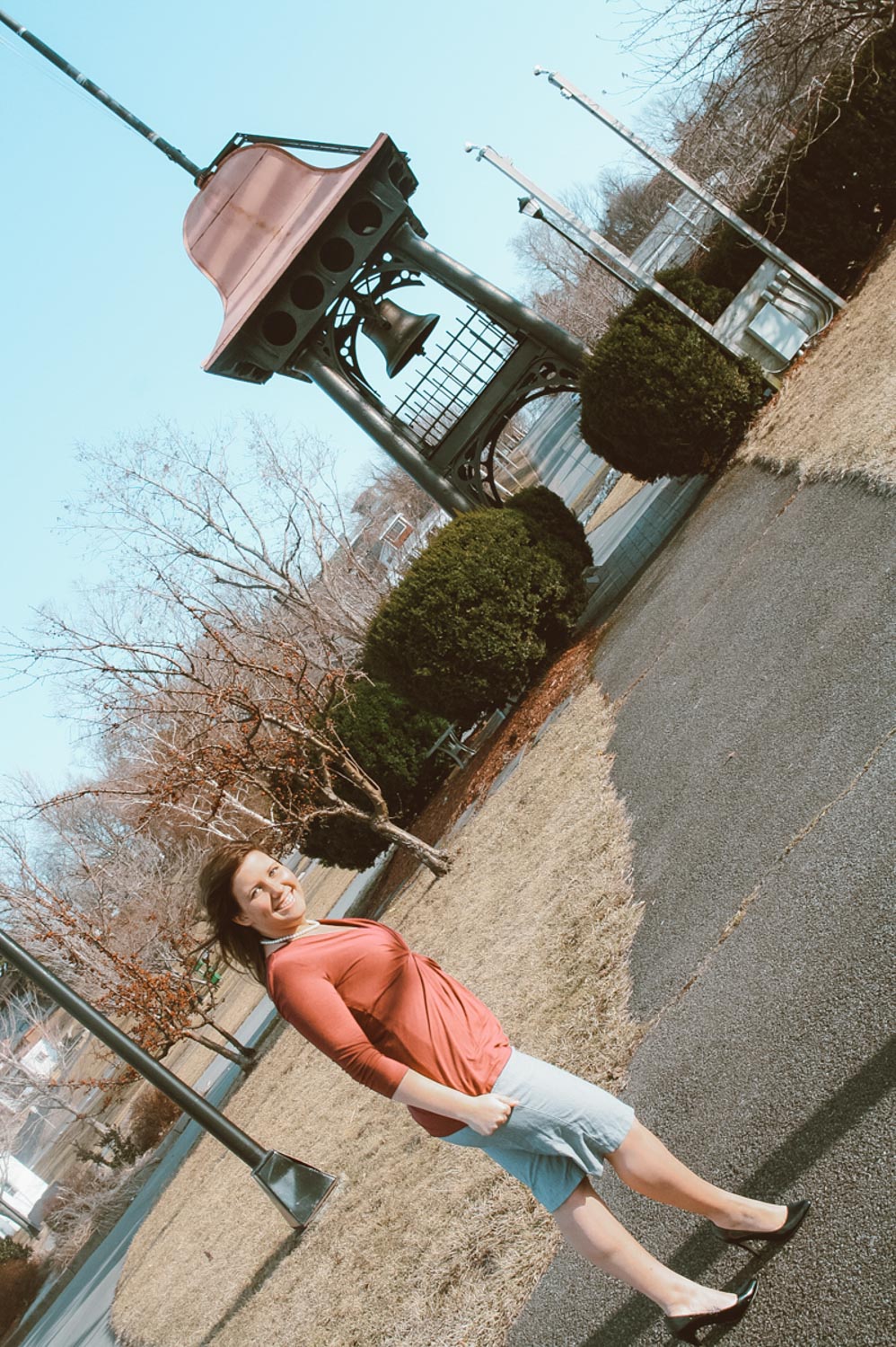 A woman walking and smiling at Breitbeck Park