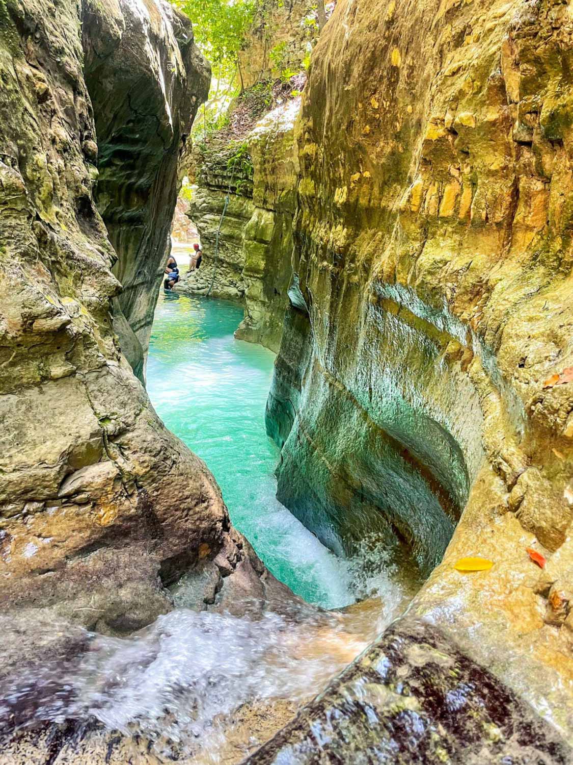 A natural pool sandwiched between rock walls in the Dominican Republic.