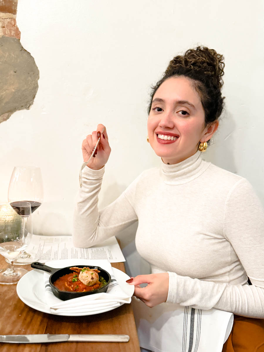 A woman dining in at FLX Table in Geneva, the Finger Lakes region