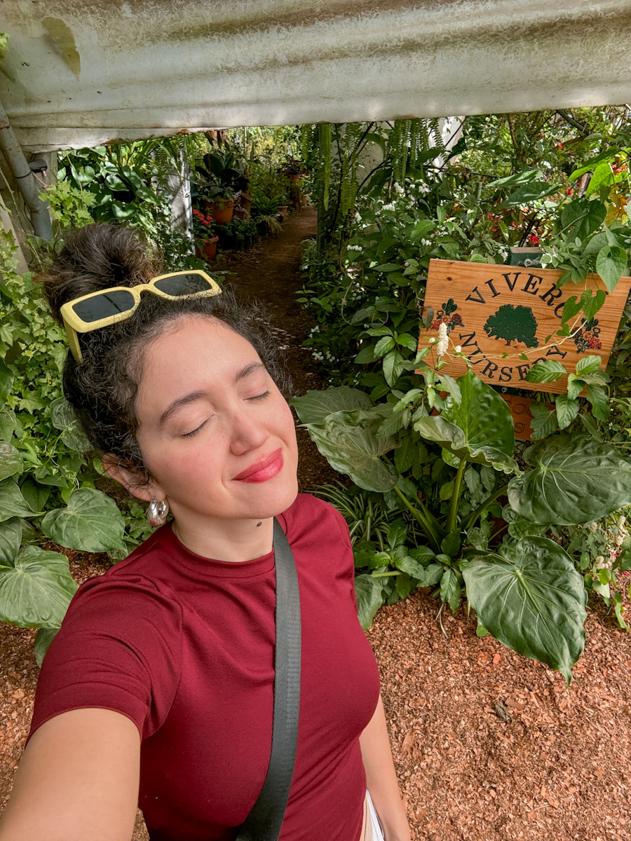 A woman in red shirt at a farm in Antigua, Guatemala.
