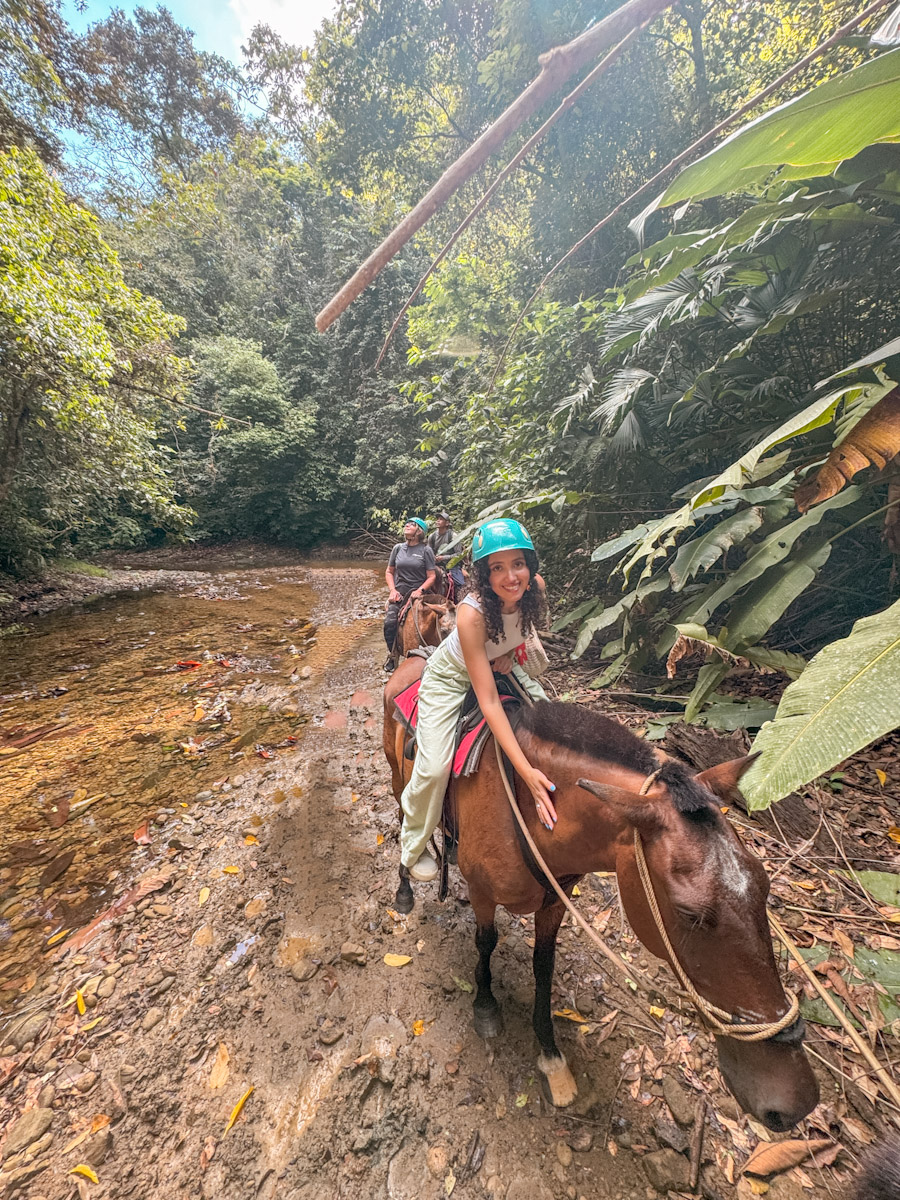 A woman riding a horse in Costa Rica.