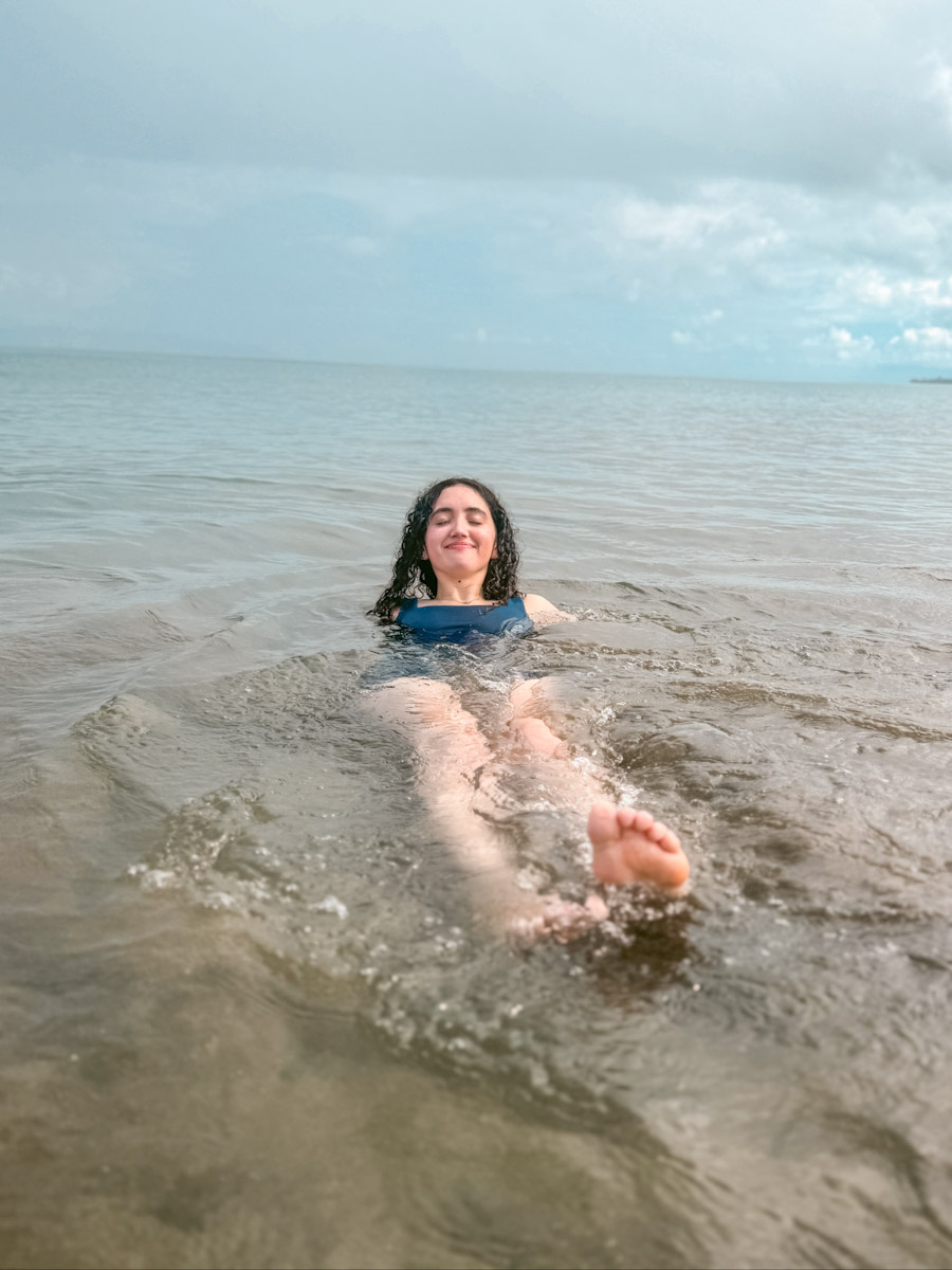 A woman swimming in the sea at Playa Preciosa in Costa Rica.
