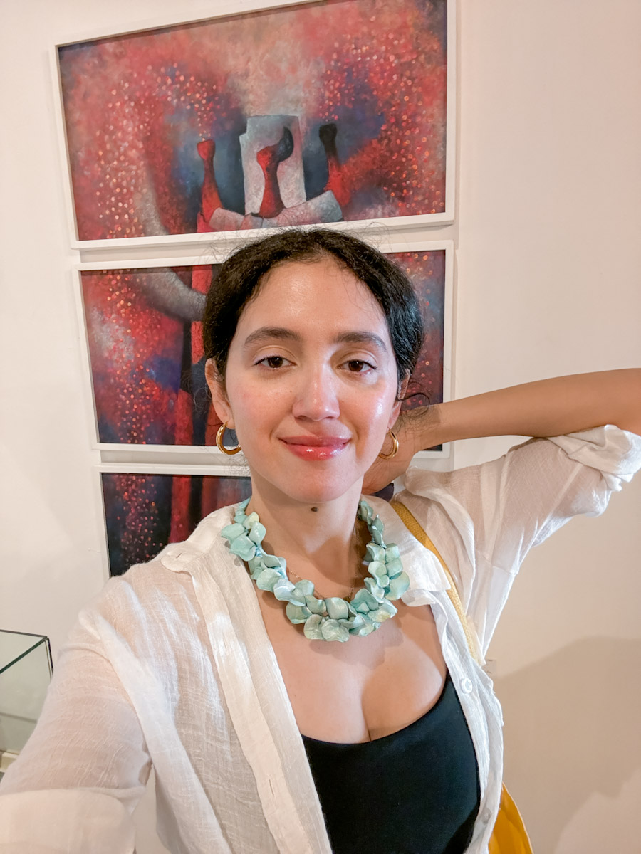 A woman trying on a necklace at a shop in Antigua, Guatemala.